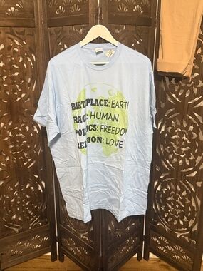 Light Blue Graphic Tee with Green Globe Print